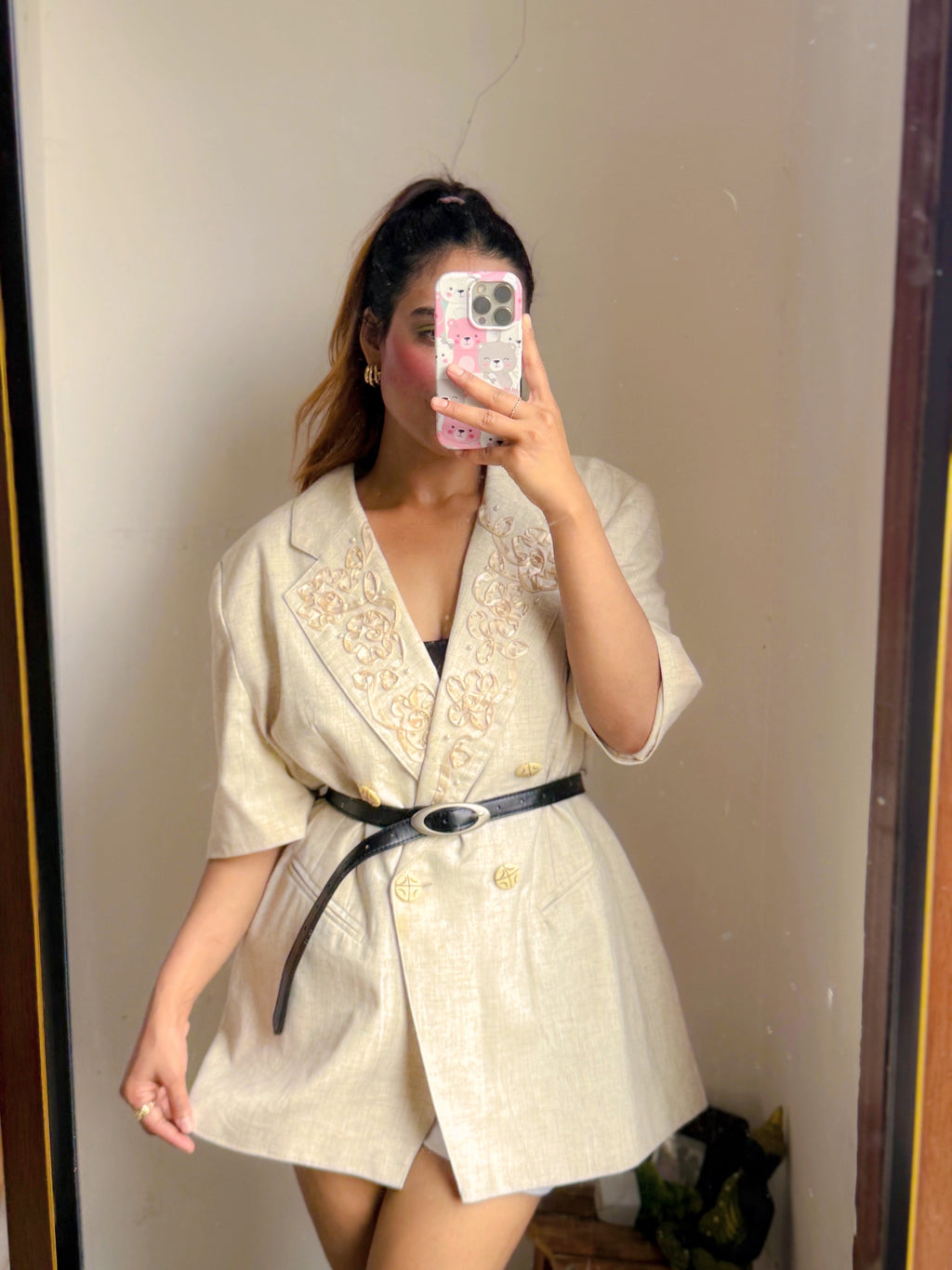 Ivory toned blazer with notched lapels, comes with embroidery work details on the collar.